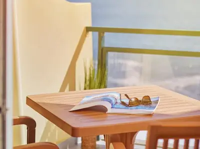 a pair of glasses sitting on a book on a table at Lovely apartment with pool and sea view in Funchal