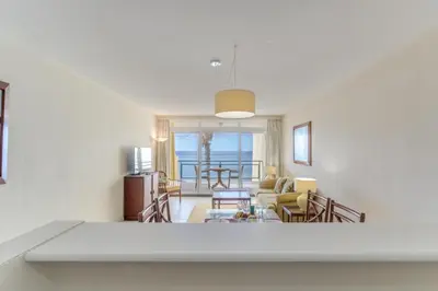 a living room with a view of the ocean at Tranquil Beachside Stay - Atlantic Gardens Beach in Funchal