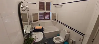 a small bathroom with a toilet and a sink at Paraíso Resiliente in Santana