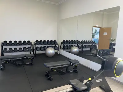 a gym with a row of chairs and a mirror at Fairway 3 Apartment - Boavista Golf & Spa Resort in Lagos