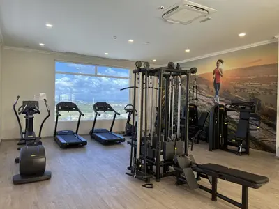 a gym with a bunch of tread machines in a room at Fairway 3 Apartment - Boavista Golf & Spa Resort in Lagos