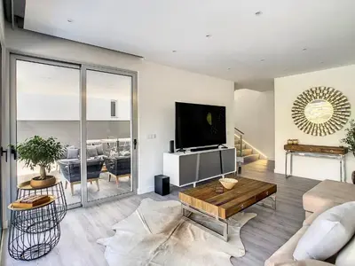 a living room with a couch and a tv at Wild River Villa by LovelyStay in Ribeira Brava