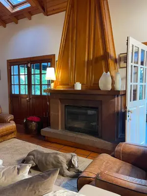 a bedroom with a bed with two shoes on it at Casas de Pedra in Camacha