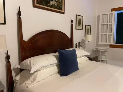 a dining room with a table and chairs at Casas de Pedra in Camacha