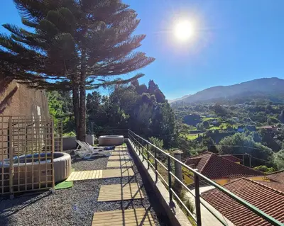 a view from the balcony of a house with a tree at Sleep and Go in Santana in Nature B&B in Santana