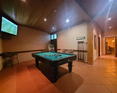 a pool table in a room with a tv at Sleep and Go in Santana in Nature B&B in Santana