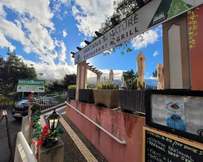 a sign for a restaurant on a street at Sleep and Go in Santana in Nature B&B in Santana