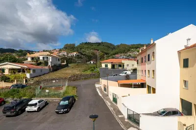 a city street with cars parked in a parking lot at Strategic Sunset House by An Island Apart in Santa Cruz