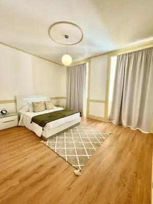 a bedroom with a bed and a rug at Carreira Apartments Harbour View Free Parking in Heart Funchal in Funchal