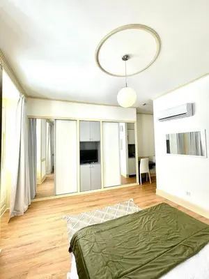 a bedroom with a bed and a living room at Carreira Apartments Harbour View Free Parking in Heart Funchal in Funchal