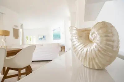 a shell sitting on a table in a living room at Casa Oceanis in Salema
