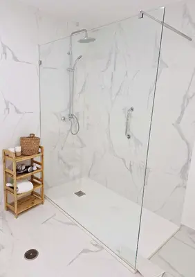 a shower with a glass door in a bathroom at Casa Oceanis in Salema