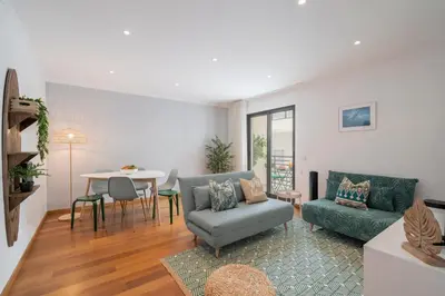 a living room with a couch and a table at Lido View Calla by An Island Apart in Funchal