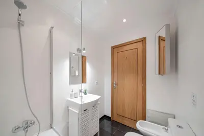 a bathroom with a sink and a shower and a toilet at Lido View Calla by An Island Apart in Funchal