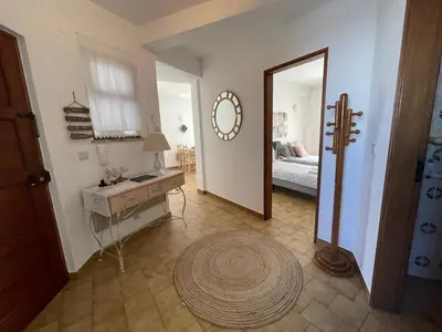 a room with a hallway with a mirror and a door at M&M's Cosy apartment - Sea view in Luz
