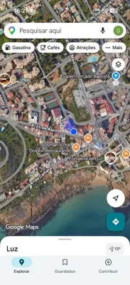 a person standing in the water on the beach at M&M's Cosy apartment - Sea view in Luz