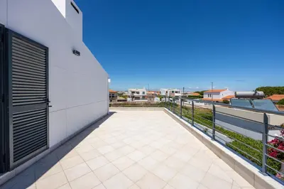 a balcony with a view of the ocean at Pontalaia Village in Sagres