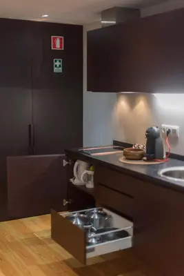 a kitchen with a sink and a counter top at Apartamentos Santa Maria by Heart of Funchal in Funchal