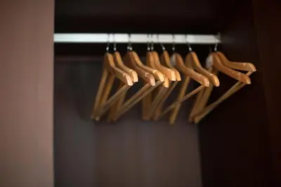 a bunch of wooden cooking utensils on a rack at Apartamentos Santa Maria by Heart of Funchal in Funchal