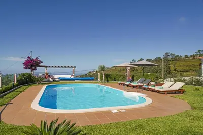 an aerial view of a house with a swimming pool at Villa Theos House by Villa Plus in Fajã da Ovelha