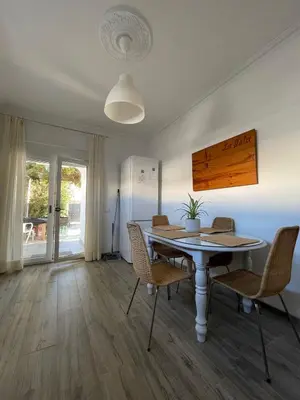 a white table with chairs and a plant on it at Casa La Isla in Sagres