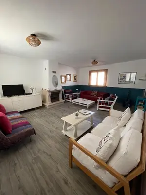 a living room with a couch and a table at Casa La Isla in Sagres