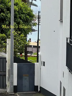 an open door to a building with a view of the ocean at Casa da Praia, 2min de la PLAGE, hyper centre in Machico