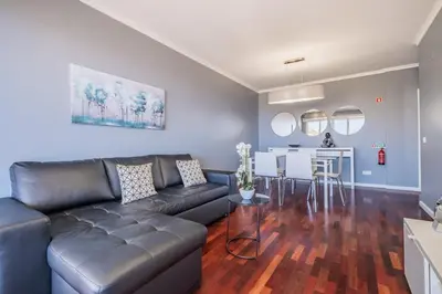a living room with a couch and a table at Canico Vip Lodging by Homie in Santa Cruz