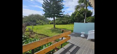 a view of a garden from the porch of a house at Discovery Apartment with patio Discovery 2 in Machico