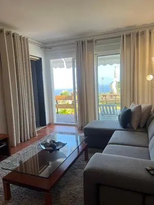 a living room with a couch and a coffee table at Discovery Apartment with patio Discovery 2 in Machico
