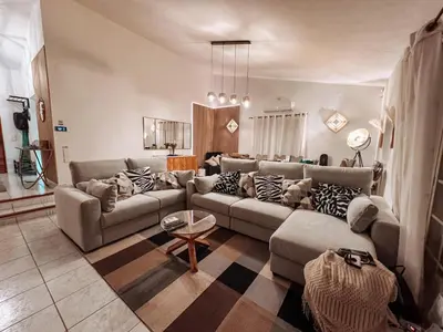a living room with a couch and a table at Villa Rubix in Luz