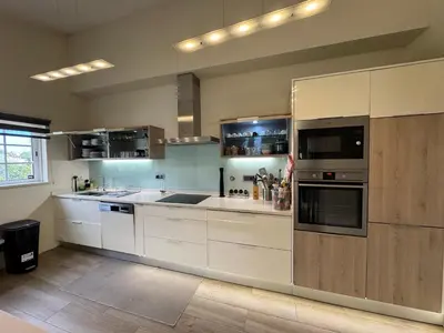a large kitchen with white cabinets and appliances at Villa Rubix in Luz