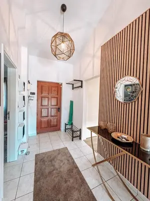 a living room with a tv on a wall at Villa Rubix in Luz