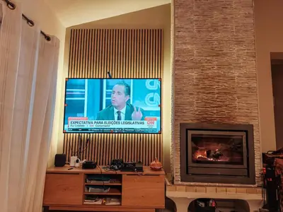 a living room with a tv and a fireplace at Villa Rubix in Luz