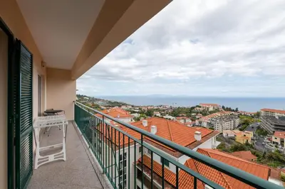a balcony with a view of the ocean at Caniço Quintas III by Trip2Portugal in Caniço