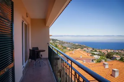 a balcony with a view of the ocean at Caniço Quintas III by Trip2Portugal in Caniço