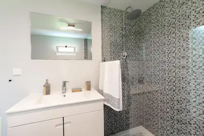 a bathroom with a sink and a shower at Casa Miradouro do Pigarro, Sunny Apartment in Calheta