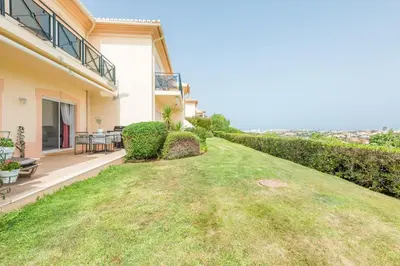 a view of a house with a yard at Boavista Charming Apartment in Lagos
