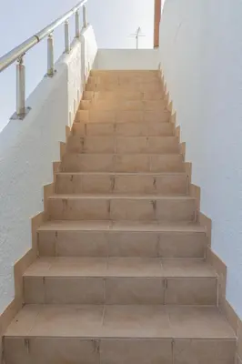 a set of stairs in a stair case at Casa Jana 5 Bedroom House for 12 with Ocean View Terrace near the Beach in Burgau