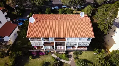an overhead view of a building with an orange roof at Madeira Ocean View by Atlantic Holiday in Caniço