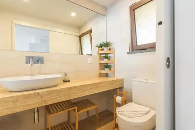 a bathroom with a sink and a toilet at Madeira Ocean View by Atlantic Holiday in Caniço