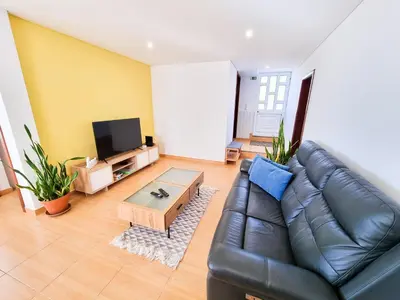 a living room with a leather couch and a coffee table at Casa Torbit, Apartment in Arco da Calheta in Arco da Calheta