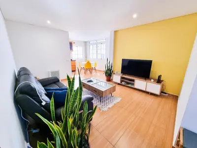 a living room with a couch and a tv at Casa Torbit, Apartment in Arco da Calheta in Arco da Calheta