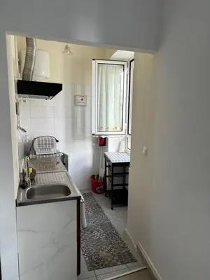 a small kitchen with a sink and a window at Cc39-Q4 in Funchal