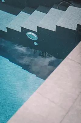 a reflection of a frisbee in a pool at QUINTA TORRINHA LUXODREAM Apartment in Funchal