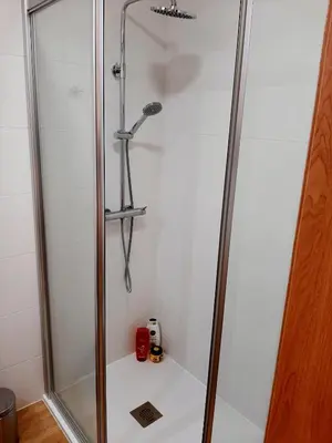 a shower in a bathroom with a glass door at Superb Sea View Flat in Funchal in Funchal