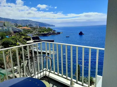 a view of the ocean from a balcony at Superb Sea View Flat in Funchal in Funchal