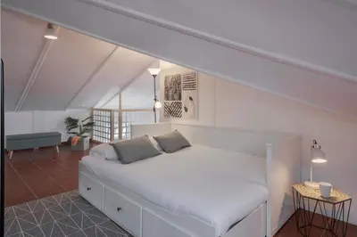 a white bed with two pillows on it in a room at Vila Boa Vista by An Island Apart in Funchal