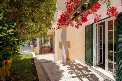 a house with flowers on the side of it at Vila Boa Vista by An Island Apart in Funchal
