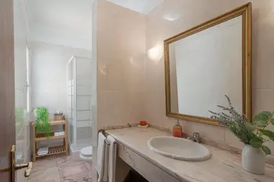 a bathroom with a sink and a mirror and a toilet at Vila Boa Vista by An Island Apart in Funchal